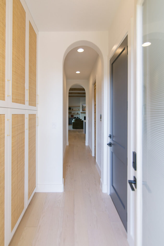 Five Oaks Custom Builders - home renovation with custom styling for central texas - exposed natural wood accents and warm minimalism - arched hallways