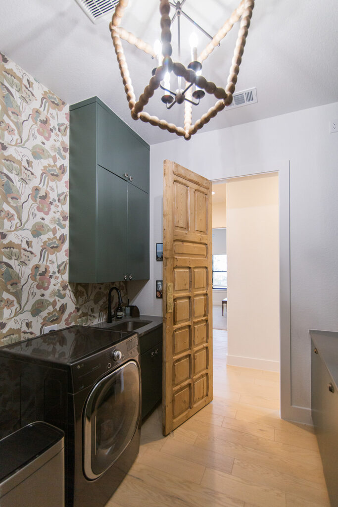 Five Oaks Custom Builders - home renovation with custom styling for central texas - exposed natural wood accents and warm minimalism - cozy designs with warm floral wallpaper accent wall in laundry room