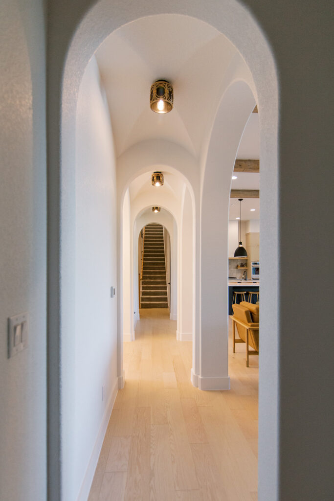 Five Oaks Custom Builder - Hallways with arched doorways in the Austin, Texas area