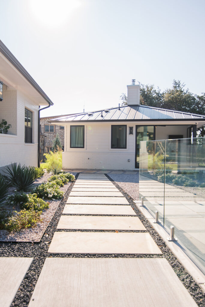 Five Oaks Custom Builders - home renovation with custom design and styling for central texas - sliding door to outdoor living - hardscaping for guest house in Austin, Texas - Leander area